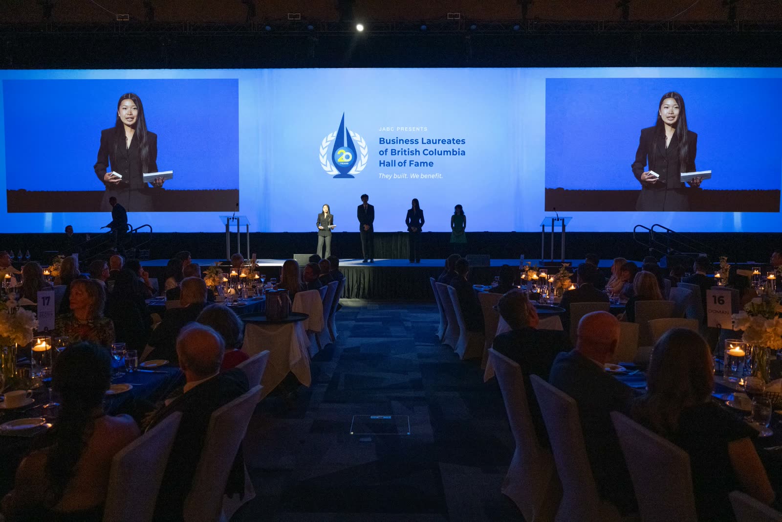On stage at the BC Business Laureates Hall of Fame, both jumbotron screens live behind